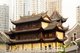 China: Modern buildings loom over Ming-era Buddhist Qianming Temple, Guiyang, Guizhou Province